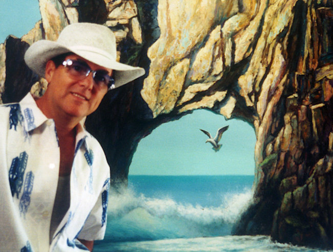 Sambataro, standing in front of his large (5 x 8 ft) painting of Cabo San Lucas